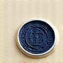 A silver wax seal on a legal document representing confidentiality